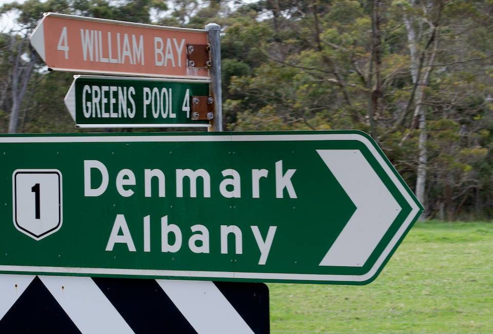 A road sign with Denmark and Albany pointing the same way. 